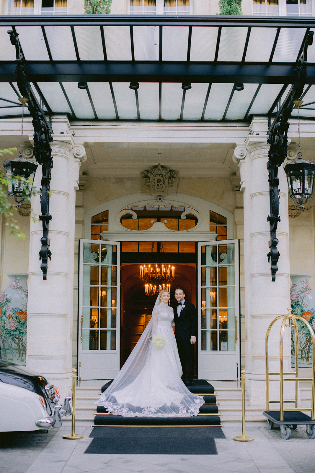 The brides are in front of the entrance to the Shangri La Palace